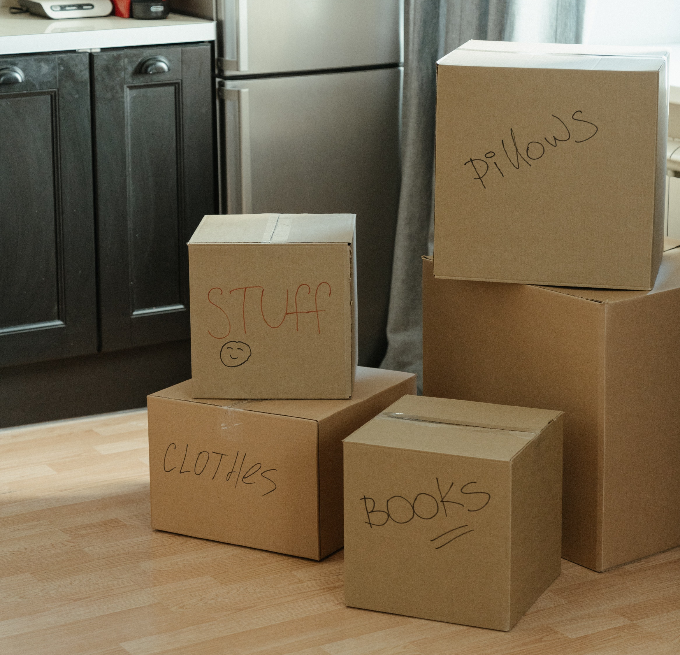 Image of several boxes, all labelled and ready for storage in an EZ Self Storage container